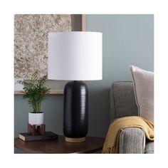 This 1 light Table Lamp from the Everly collection by Surya will enhance your home with a perfect mix of form and function. The features include a Black finish applied by experts.   Product Features Include: Brand: Surya  Collection: Everly  SKU: ERL-002  UPC: 888473774884  Category: Table Lamp  Finish: Black  Material: Linen/Polyester/Ceramic/Wood/Metal  Length: 13.00  in.  Width: 13.00  in.  Height: 25.50  in.  Backplate/Canopy Width: 0.00  in.  Backplate/Canopy Length: 0.00  in.  Weight: 5.00 Black Modern Table, Black Table Lamp, Black Table Lamps, Black Table, Portable Light, Modern Forms, Burke Decor, Black Lamps, Modern Table Lamp