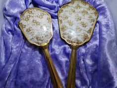 Lovely two piece vintage vanity dressing table set. Hairbrush and hand mirror. Gold tone handles, lace and gold embroidery backs. Some signs of age on handles and few rust marks on lace. Otherwise great vintage condition. Mirror 32cm hairbrush 24cm. **postage outwith UK is estimated figure please message me for more accurate cost** **Please request postage quote for all areas not listed** Antique Hand Mirror, Vintage Hand Held Mirror, Vintage Brush And Mirror Set, 20s Hand Mirror, Dressing Table Vanity, Art Nouveau Dressing Table/stool For Sale, Dressing Table Set, Dresser Sets, Pink And Blue Flowers