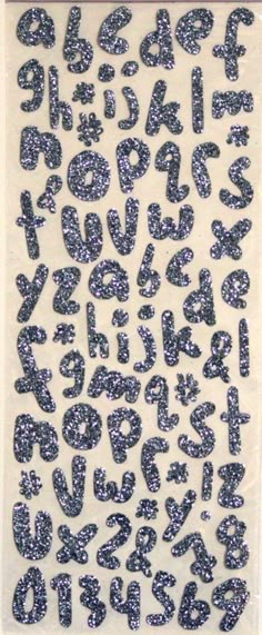 the letters and numbers are made out of blue sequinized glitter on white paper