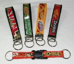 four lanyards with chips on them are sitting in the shape of a keychain