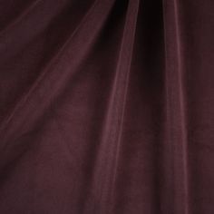 a close up view of a maroon colored fabric