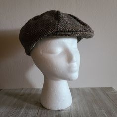 "Love this Vintage Tweed Newsboy Cap!  Unsure of the date looks older. Nice gray and brown tweed pattern. Marked L.L.Bean by Hanna Hats of Donegal LTD. Donegal Town Ireland, Dry Clean Only, Pure New Wool. Size Medium, the mannequin in the photos has a 21\" diameter head and it's a bit big and loose on it. It does fit a 23\" head perfectly.  Great vintage condition. Does show signs of age and use.  Slight fading on the inside band. Snap works and holds tight. No weird smells. Has not been dry cle Tweed Cap With Herringbone Pattern, Classic Adjustable Tweed Hat, Fall Herringbone Hat With Short Brim, Brown Tweed Hats With Herringbone Pattern, Tweed Hats With Herringbone Pattern, Tweed Brimmed Hat With Herringbone Pattern, Adjustable Tweed Flat Cap, Fitted Tweed Cap, Tweed Hat With Herringbone Pattern And Short Brim