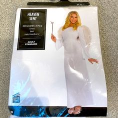 a woman in a white dress holding a wand and wearing an angel costume for halloween