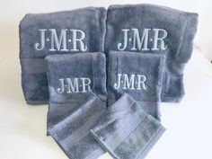 four personalized towels with the word mr and mrs on them