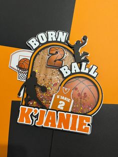 an orange and black basketball themed wall with the number two in it's center