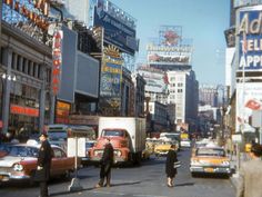 an old photo of people and cars on the street in times square, new york city