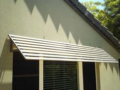 an awning on the outside of a house