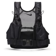 Find NIKE Transform Packable Running Vest on Editorialist. READY TO TRANSFORM. Go from fanny pack to vest and back again with 1 versatile design: the Nike Transform Vest. Lightweight fabric designed for maximum breathability folds into a zip pocket on the integrated fanny pack when your needs are minimal. You can find a custom, stable, comfortable fit with the adjustable chest and side straps and multiple stretchy mesh pockets give you plenty of room to store essentials and easy access on the go Running Vest Aesthetic, Nike Street Wear, Techwear Vest, Nike Vest, Running Accessories, Running Vest, Nike Store, Nike Running, Workout Clothes