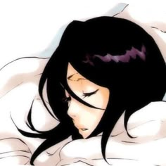 a woman laying in bed with her eyes closed and head turned to the side, she has long black hair