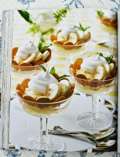 a cookbook with desserts in it on a table