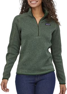 Fit and Design: Slim fit Quarter-length front zipper with wind flap and kissing-welt closure Zippered security pocket on sleeve Micro polyester jersey trim on cuffs, wind flap and hem Princess seams on back Hip length Zip Pullover Sweater, 1/4 Zip Sweaters, Women Quarter Zip Sweater, 1/4 Sweaters, Patagonia Fleece Woman, Quarter Zip Sweater Green, Green Better Sweater, Patagonia Quarter Zip Fleece, Sweaters Patagonia