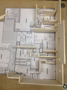 the floor plan for an apartment is cut up and ready to be put into place