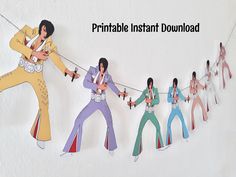 paper cut out of elvis presley and the jacksons playing with string on white background