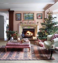 a living room filled with furniture and a fire place in the middle of it's wall