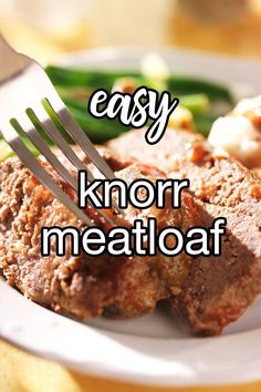 a white plate topped with meat and veggies next to a fork that says easy knorr meatloaf