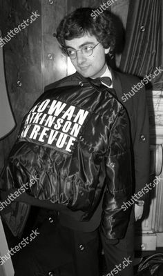 a young man wearing a jacket with the words i want prison to revue written on it