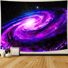 a wall hanging on the side of a room with a purple and blue spiral design