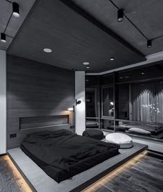 a large bed sitting in the middle of a bedroom