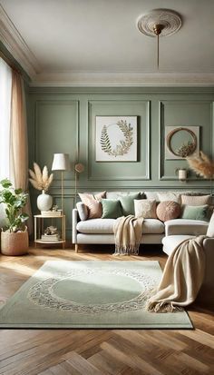 a living room with green walls and wooden floors