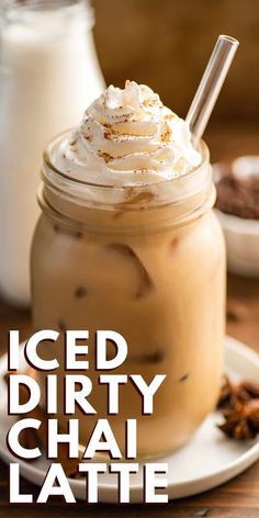 iced dirty chai latte in a mason jar with whipped cream and cinnamon on top