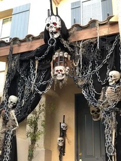 halloween decorations with skulls and chains hanging from the roof