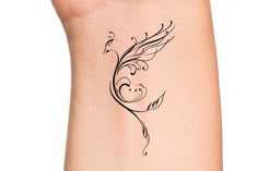 a woman's arm with a tattoo design on the back of her left arm