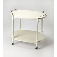 an oval white table with two black wheels on the bottom and one shelf below it