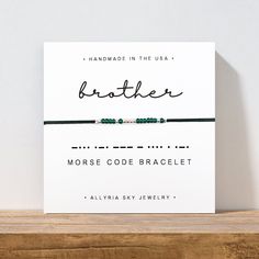 a card that says, handmade in the usa brother morse code bracelet on it