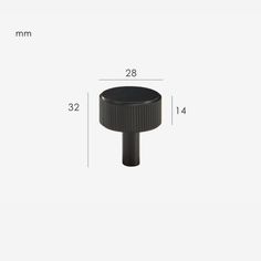 an image of a black round knob on a white background with measurements for the top and bottom