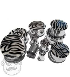 a set of four zebra print knobs and covers