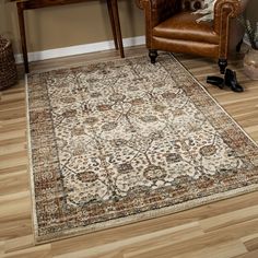 a brown chair sitting on top of a wooden floor