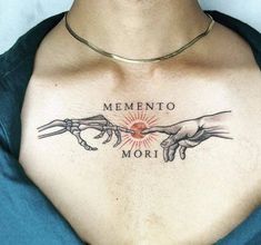 a man with a tattoo on his chest that says mementoo mort