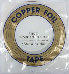 the tape is wrapped in plastic and has a gold foil stamp on it that says copper foil