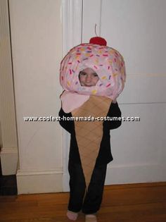 a child wearing an ice cream cone costume