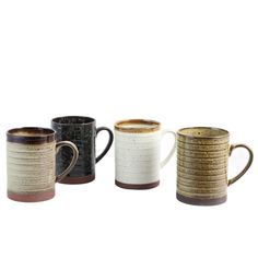 three different colored coffee mugs sitting next to each other