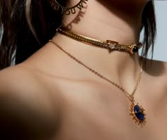 This ALLE Mysticus Choker by Mani Maalai offers a unique and modern style. Crafted from .925 silver with a 22k gold plate and featuring an intricately designed centerpiece, this piece will turn heads with its beautiful shimmer. An eye-catching choice that's sure to stand out. Gem: Citrine, lapislazuli, smoke quartz, carnelian, onyx. Metal: .925 silver with 22k gold plate Choker: 14 inches - Adjustable Modern Gold Jewelry, Edgy Jewelry, Fantasy Jewelry, Stylish Jewelry