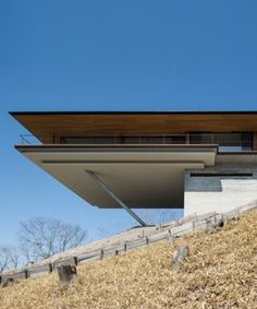 an unusual house on top of a hill