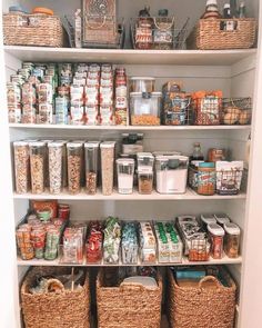 a pantry filled with lots of food and storage baskets on the bottom shelf next to each other