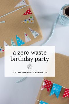 a cardboard birthday party with paper buntings and streamers on the table next to it