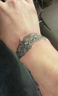 a person with a tattoo on their wrist