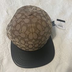 Brand New Coach Cap Designer Brown Hat With Short Brim, Designer Brown Hat For Spring, Designer Brown Hats For Spring, Brown Adjustable Flat Bill Baseball Cap, Brown Baseball Cap With Flat Bill, Brown Flat Bill Baseball Cap For Streetwear, Brown Fitted Hat With Flat Bill, Designer Black Spring Hats, Designer Black Hats For Spring