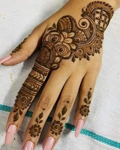 henna tattoo on the palm of a woman's hand