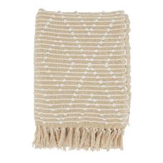 a beige and white blanket with fringes