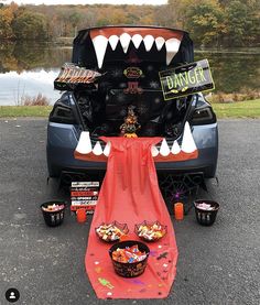 the trunk of a car is decorated with halloween decorations and fake teeth to look like a monster's mouth