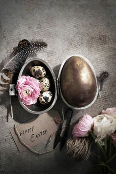 an image of easter eggs and flowers on the table