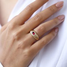 Introducing our exquisite handmade jewelry collection on Etsy, where elegance meets craftsmanship in every piece. Behold the stunning 14k gold ring adorned with a captivating red round gemstone a symbol of passion and love. Crafted with meticulous attention to detail, this solid gold ring is more than just jewelry; it's a promise of eternal devotion. Whether you're searching for the perfect birthday gift, a meaningful anniversary present, or a unique piece to celebrate Mother's Day, this ring is 14k Gold Ruby Halo Ring For Promise, 14k Gold Ruby Halo Promise Ring, Gold Dainty Ruby Ring For Formal Occasions, Dainty Gold Ruby Ring For Formal Occasions, Elegant Diamond Signet Ring With Birthstone, Dainty Oval Ruby Ring In Gold, Gold Ruby Ring With Halo For Gift, Dainty Gold Oval Ruby Ring, Heirloom 14k Gold Halo Birthstone Ring