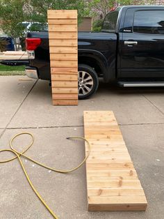 a truck parked next to a wooden bench