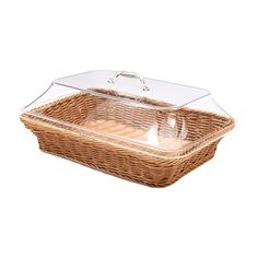 a wicker basket with glass lid on a white background for use as a serving tray