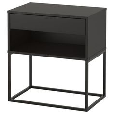 a black night stand with one drawer on the top and two shelves below it that are both open