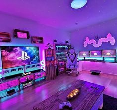 a living room filled with furniture and purple lighting